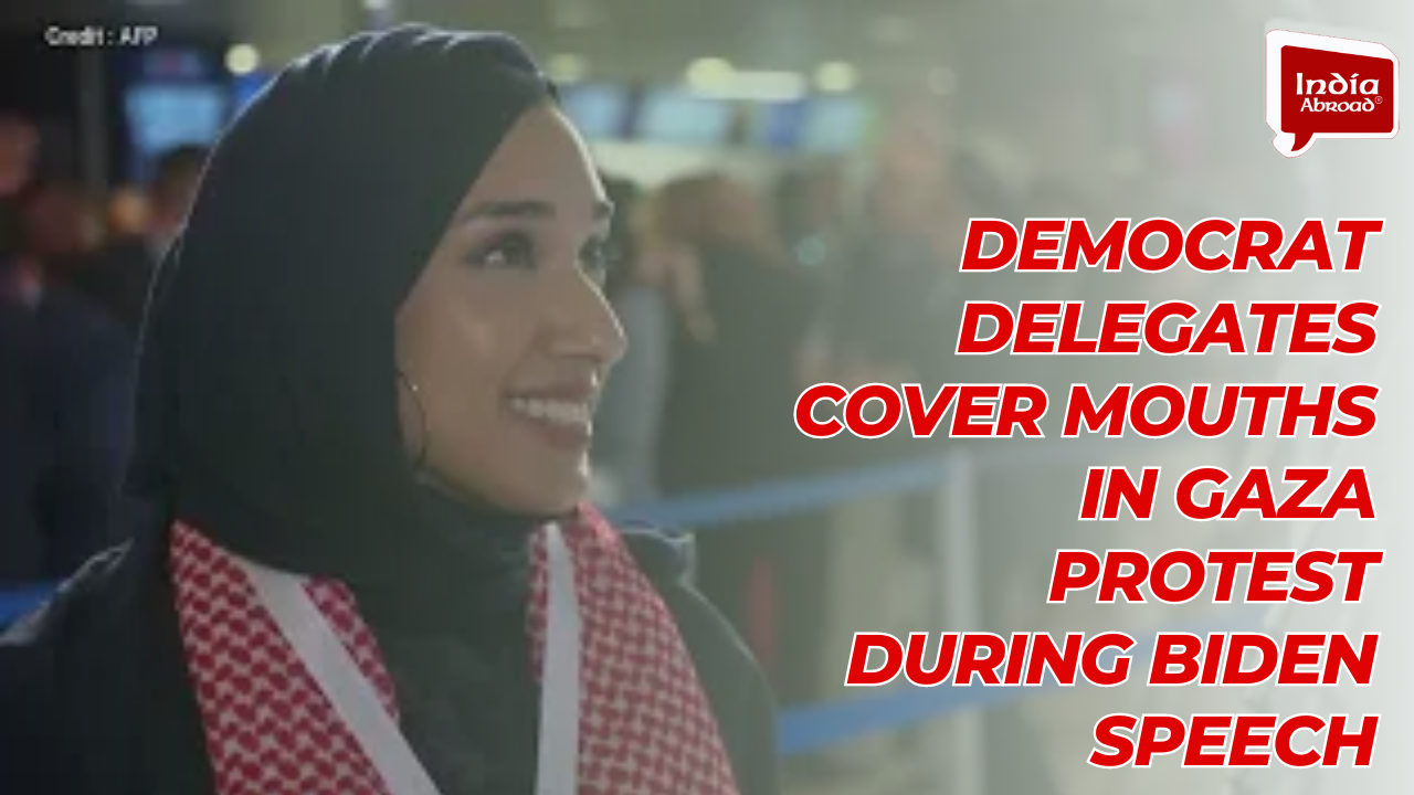 Democrat delegates cover mouths in Gaza protest during Biden speech